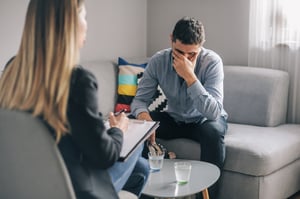 Man speaking to therapist